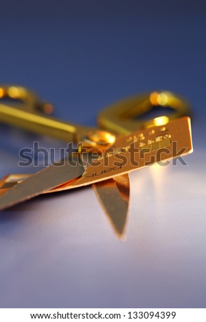 scissors cutting credit card away