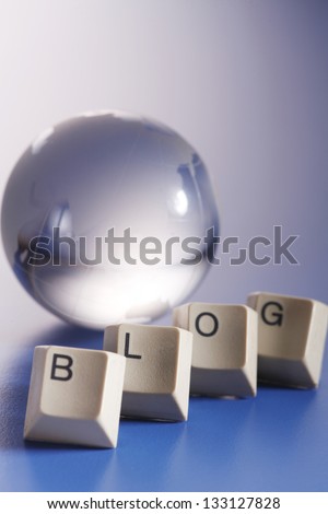 word BLOG in front of the glass globe