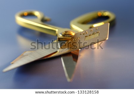 scissors cutting credit card away