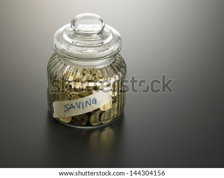 jar of coin with label saving