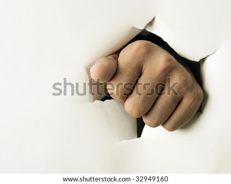 man punch through the paper with hand