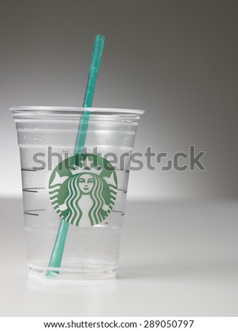 KUALA LUMPUR, MALAYSIA - june 6TH, 2015.Empty Starbucks coffee plastic cup on black background. Starbucks is the world\'s largest coffee house with over 20,000 stores in 61 countries