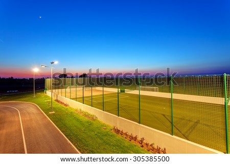 Small football pitch in sports center at night