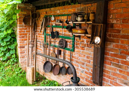 Old tools and kitchen appliances in backyard of Serbian mountain house