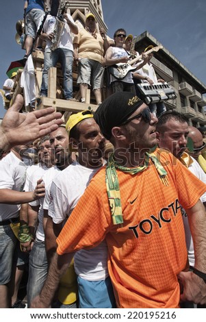NOLA, ITALY - JUNE 24, 2012: Gigli Parade is a popular festival during of the celebrations for St Paul. Traditional procession of lilies, wooden obelisks 25 mt high carried on the 120 men shoulders