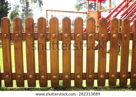 brown wood on a playground fence