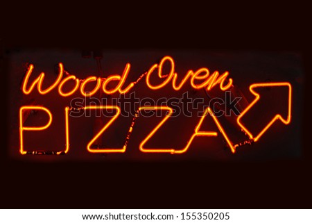 An orange neon sign reading Wood Oven Pizza