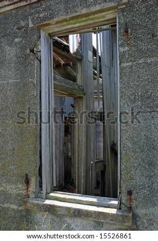 A window in a dilapidated old shack