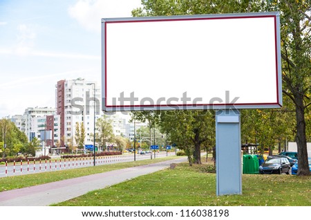 Blank billboard on road in city useful for advertising