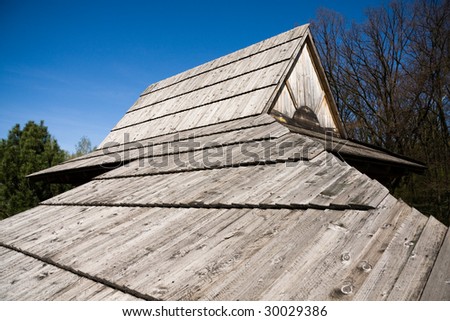 Wide angle image of tradition polish wooden roof in old cabin.
