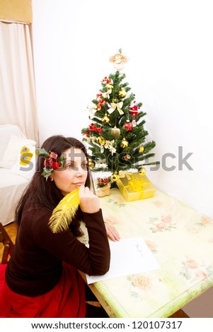 Woman thinking at gift ideas for Christmas. Christmas wish. Christmas time.