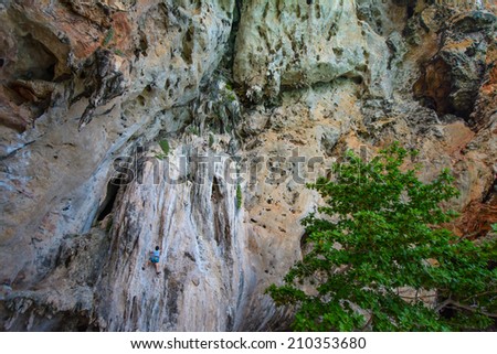 women climbing hard overhanging wall in Krabi, Thailand