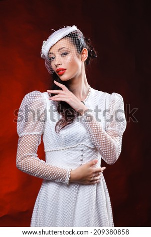 young girl in retro dress in the studio