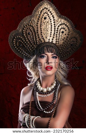 Russian Beauty. Attractive female wearing in kokoshnik. Woman\'s headdress in old Russia
