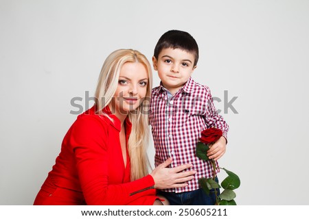 Son gives his mother flowers. Spring, March 8, International Womens, Mothers day, family holiday.
