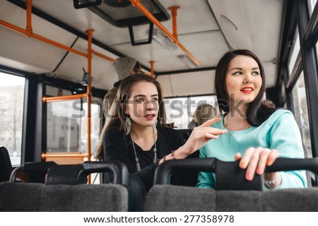 girls riding public transportation to work, study.