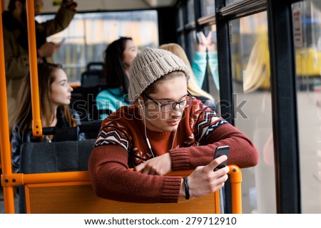 transport. people in the bus. she wondered in transport. man rides a bus, listening to music