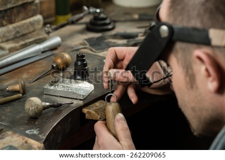 Craft jewelery making.  Ring repairing. Putting the diamond on the ring.