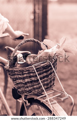 Detail of the basket with fresh food on the bike. Color toned image.