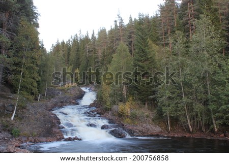 Long exposure of a waterfall on red rocks, in VÃ?Â¤rmland, Sweden.