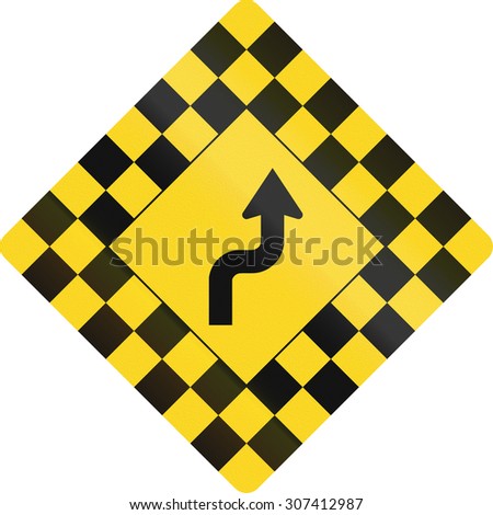 Checked warning road sign in Canada with reverse curve. This sign is used in Ontario.