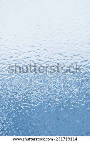 Ice texture. Frozen water drops on a window