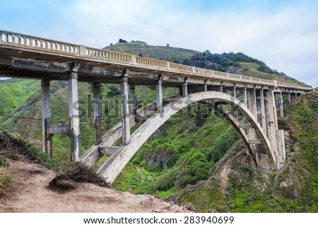 Rocky Creek Bridge historic bridge 1932, near Big Sur, California, green mountain, old bridge in highway 1 California Coastline