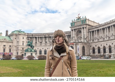 The girl on the background of the Hofburg Palace, Vienna, Austria