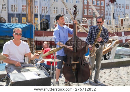 Copenhagen - June 11: Street musicians playing in Nyhavn waterfront, June 11, 2013, Copenhagen, Denmark