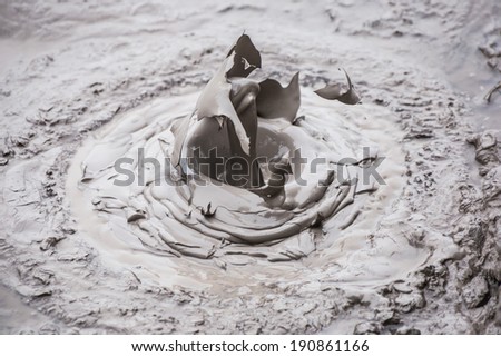 Close-up of splash of boiling mud in a mud pool in geothermal park Wai-O-Tapu, Rotorua, New Zealand