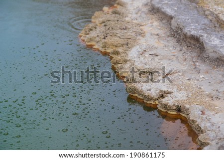 Selective focus of bubbles on a surface of Champagne Pool in Wai-O-Tapu geothermal area, Rotorua, New Zealand.