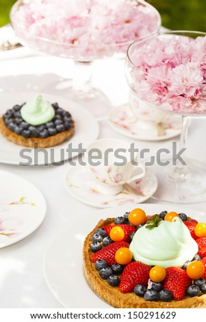 Dessert served outdoors with flowers and decoration