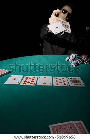 Poker player showing his cards