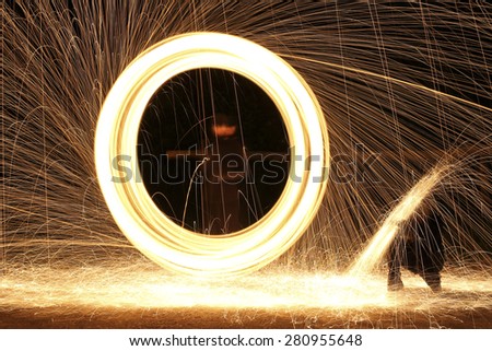 rings of fire and bright sparks light up the night