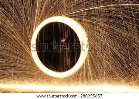 rings of fire and bright sparks light up the night