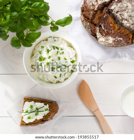 Breakfast including cottage cheese, bread and milk