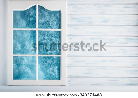 White wooden wall and a frosted window background