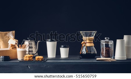 Coffee shop interior, Coffee to go and accessories on the table