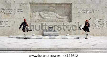 ATHENS, GREECE - APRIL 21: Evzones (presidential ceremonial guards) guarding the Tomb of the Unknown Soldier at the Hellenic Parliament Building, April 21, 2009 in Athens, Greece.