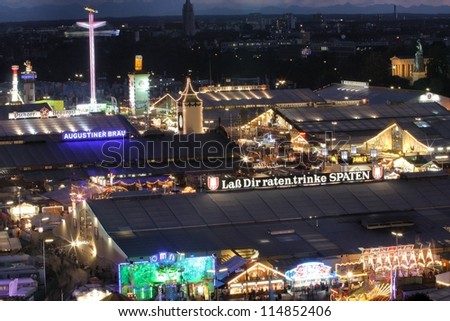 MUNICH - SEPTEMBER 28: The beer tents of the world\'s famous beer festival Oktoberfest attract crowds of visitors from all over the world on the night of September 28, 2012 in Munich, Germany.