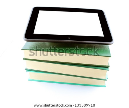 An ebook reader tablet with white screen on a stack of books