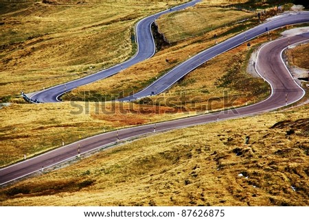 a winding road on a mountain pass