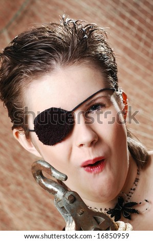 one eyed female pirate with an black eye patch having fun