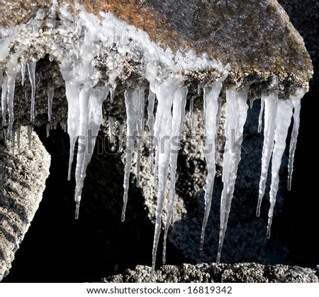 Spring. The winter draws to the end. Icicles are melting on a stone