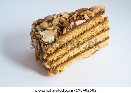 Piece of honey cake with peanuts