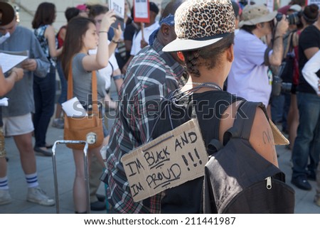 A woman wears a sign that read \
