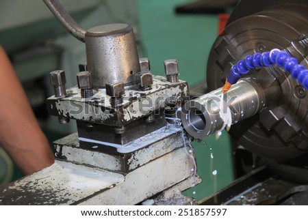 lathe machine in a workshop, Part of the lathe. Lathe machine is operation on the work shop ,Workpiece punching on the lathe