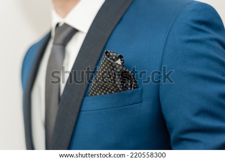 Close-up shot of a man dressed in formal wear .Groom\'s suit