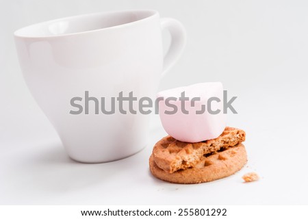 Breakfast food:  ceramic white cup with chocolate and butter cookies isolated over white background