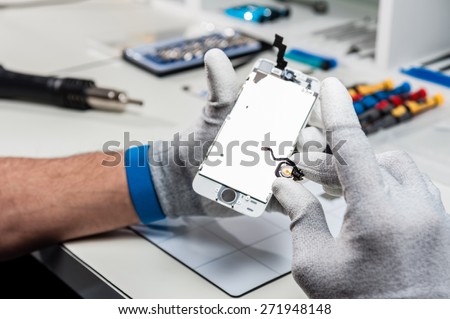 Close-up photos showing process of mobile phone repair